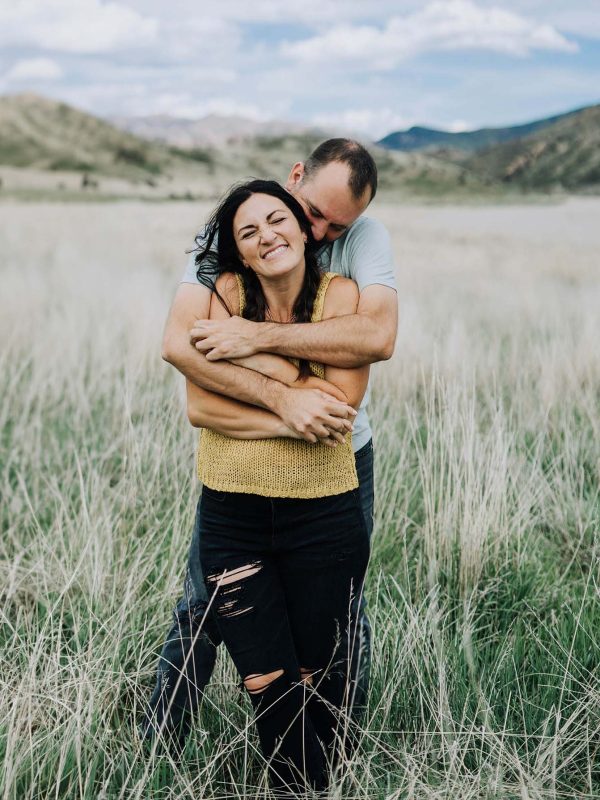 couple photos in a meadow